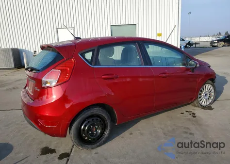 2014 Ford Fiesta Titanium z USA, uszkodzony, nr VIN 3FADP4FJ2EM154093